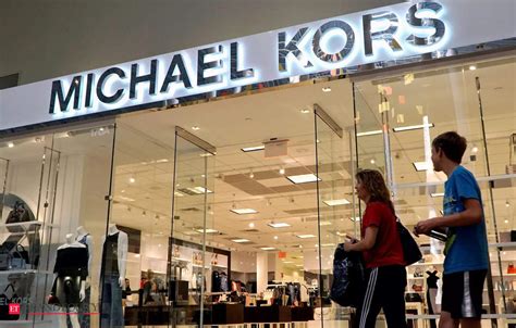 who did michael kors buy|michael kors parent company.